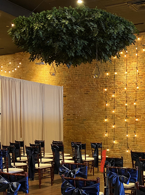 greenery chandelier with fairy lights over the dance floor